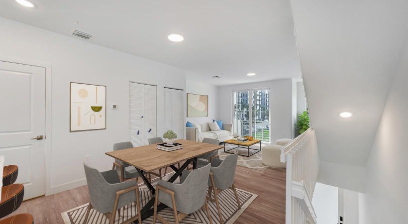 a room with a table chairs and a couch