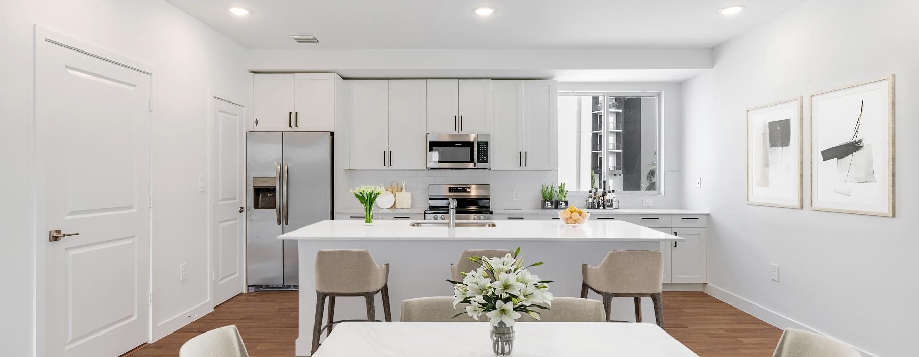 a kitchen with white cabinets