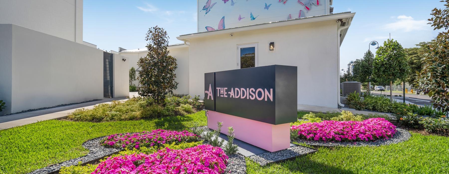 a sign in front of a building