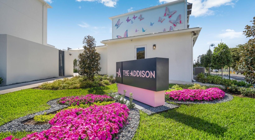 a sign in front of a building